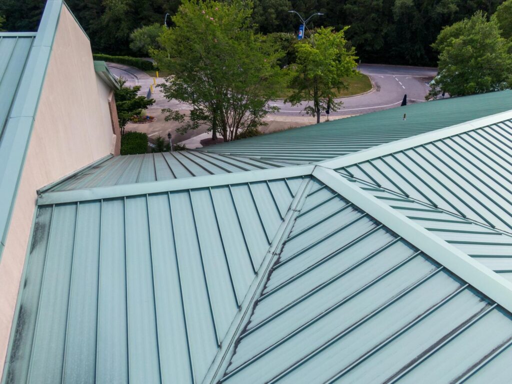 Metal roofer in Ashland City, TN installing energy-efficient roofing panels
