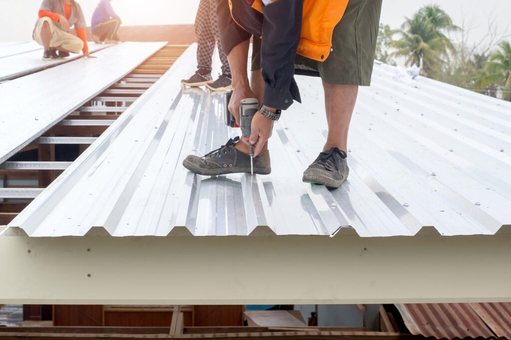 Metal roofer near me in Ashland City, TN working on a storm-resistant roof system