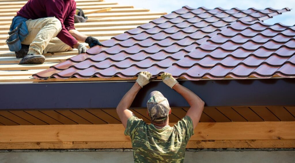 Metal roofer near me in Murfreesboro, TN finishing a custom panel roof