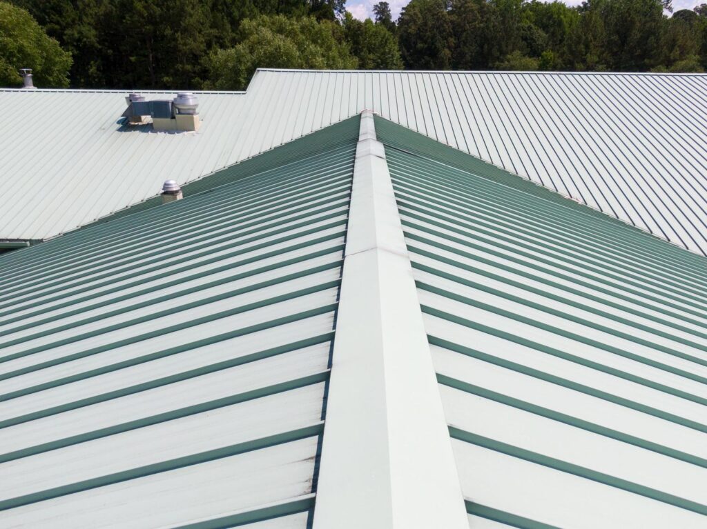 Metal roofer in Mt. Juliet, TN installing a rust-proof roof system on a family home